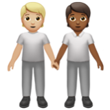 Apple(iPhone) People Holding Hands: Medium-Light Skin Tone, Medium-Dark Skin Tone Emoji