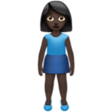 Apple(iPhone) Woman Standing: Dark Skin Tone Emoji