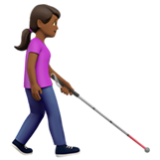 Apple(iPhone) Woman With White Cane Facing Right: Medium-Dark Skin Tone Emoji