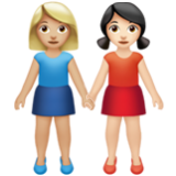 Apple(iPhone) Women Holding Hands: Medium-Light Skin Tone, Light Skin Tone Emoji