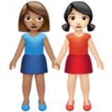 Apple(iPhone) Women Holding Hands: Medium Skin Tone, Light Skin Tone Emoji