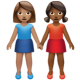 Apple(iPhone) Women Holding Hands: Medium Skin Tone, Medium-Dark Skin Tone Emoji