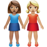 Apple(iPhone) Women Holding Hands: Medium Skin Tone, Medium-Light Skin Tone Emoji